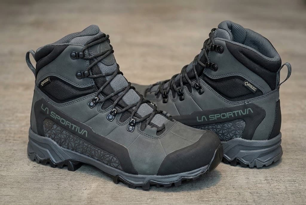 A pair of gray La Sportiva high-top hiking boots with visible GORE-TEX labels.