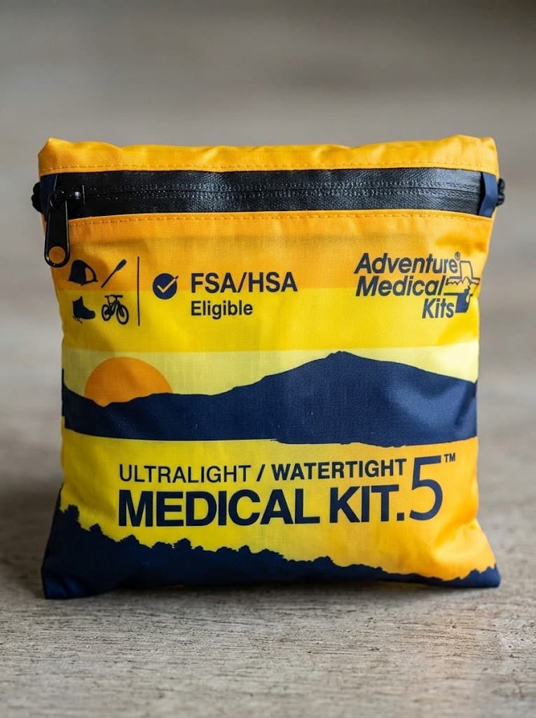 A yellow Adventure Medical Kits pouch labeled Ultralight / Watertight Medical Kit .5.